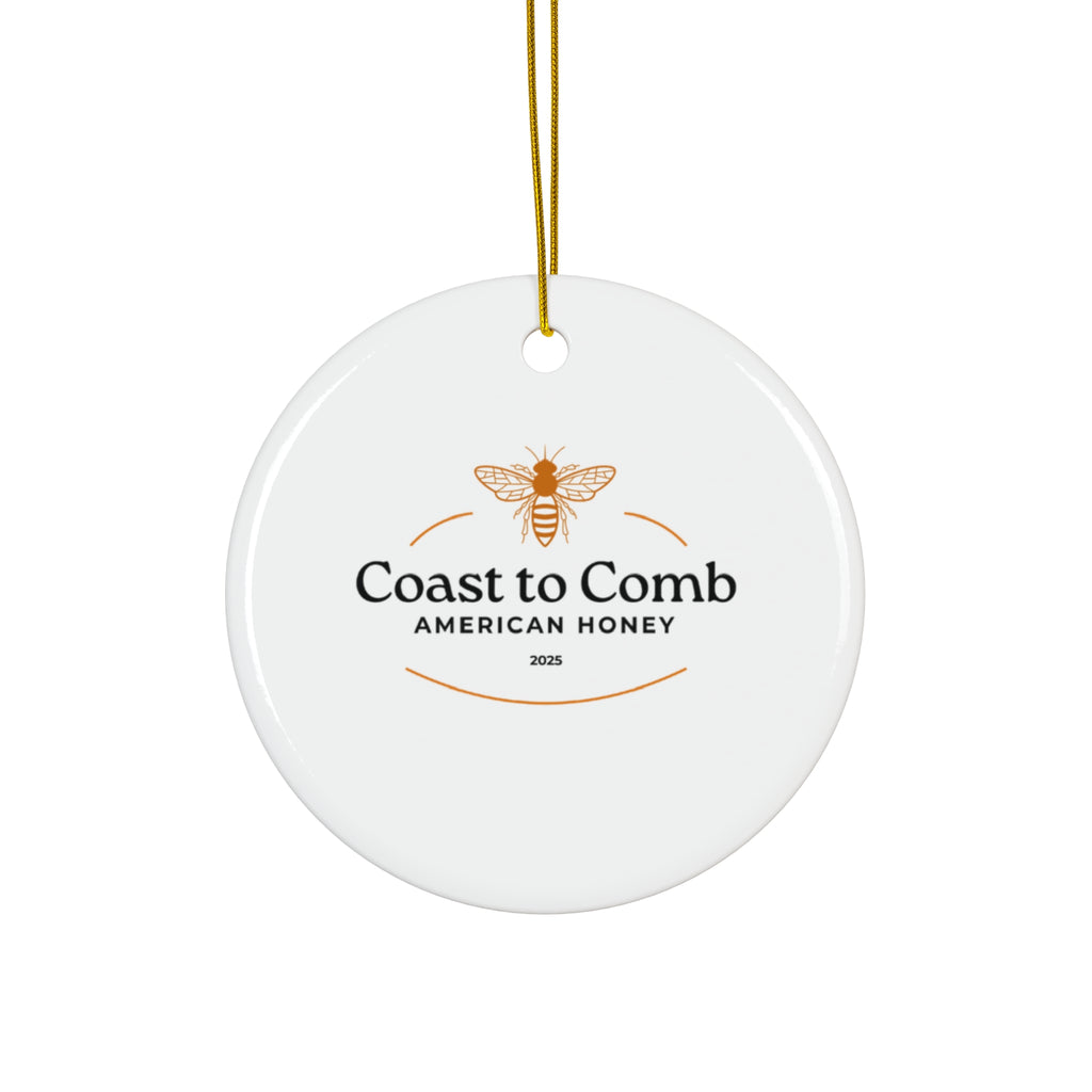Round white ceramic ornament with 'Coast to Comb American Honey' logo on a white background