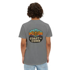 Person wearing a gray t-shirt with a 'Coast to Comb' logo on the back, standing against a white background.