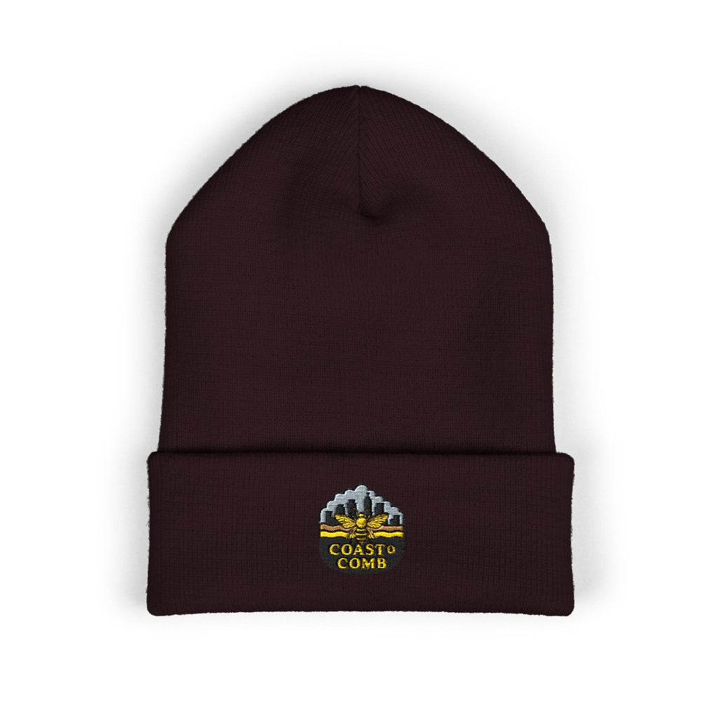 Brown beanie with 'Coastal Comb' logo on a white background