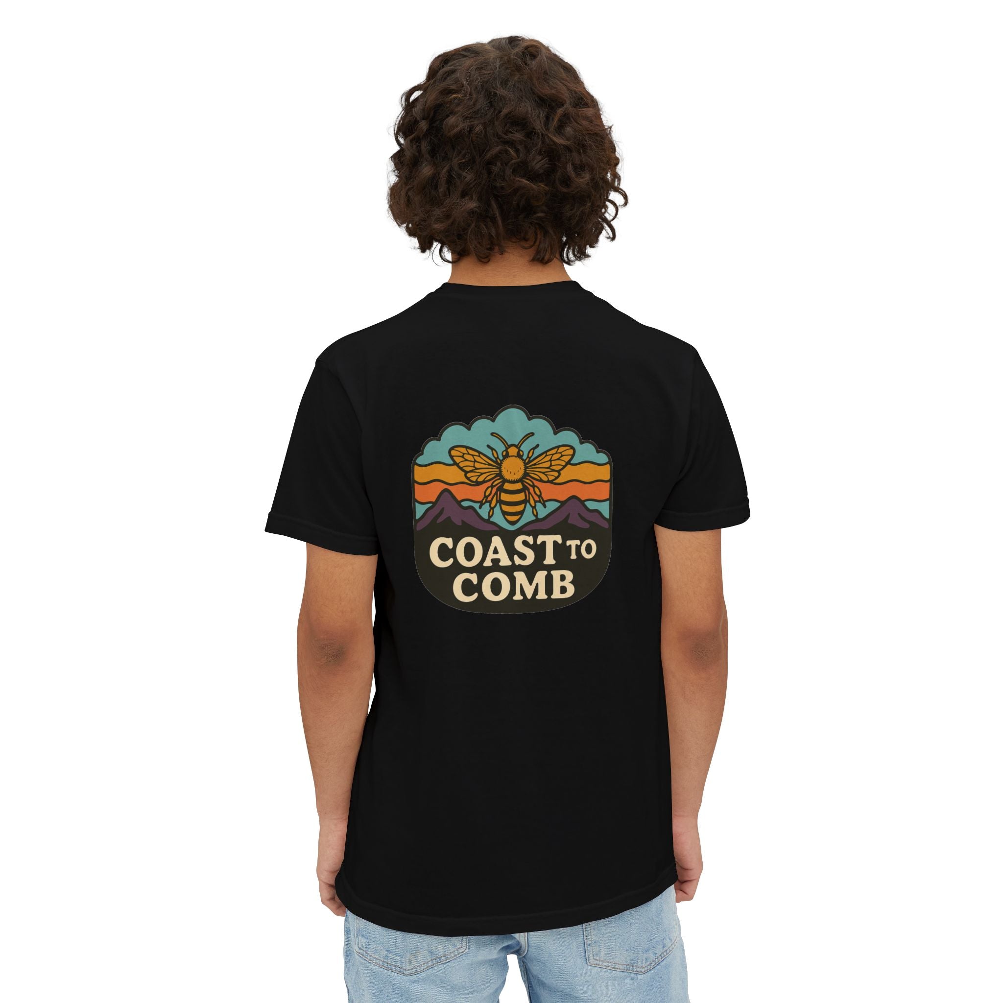 Person wearing a black t-shirt with 'Coast to Comb' design on the back, standing against a white background.