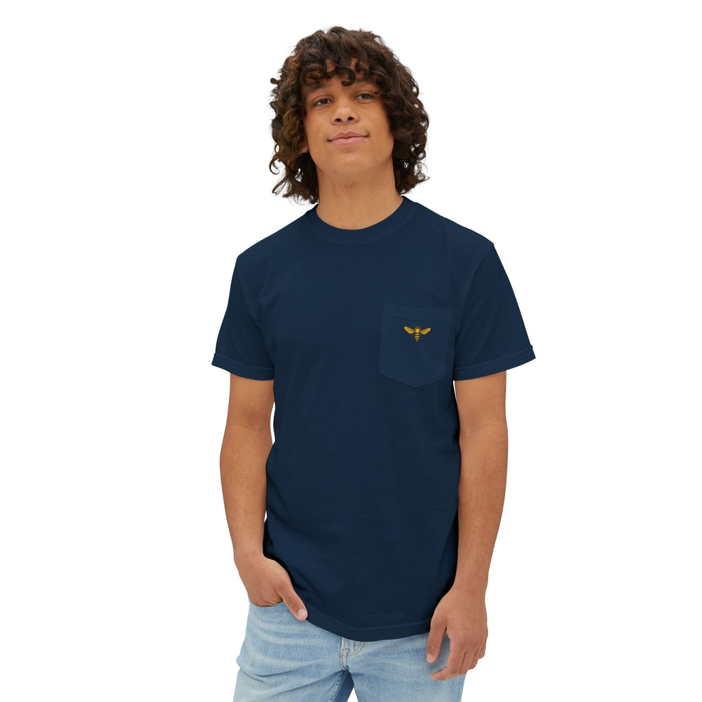 Person wearing a navy blue t-shirt with a small logo on a white background