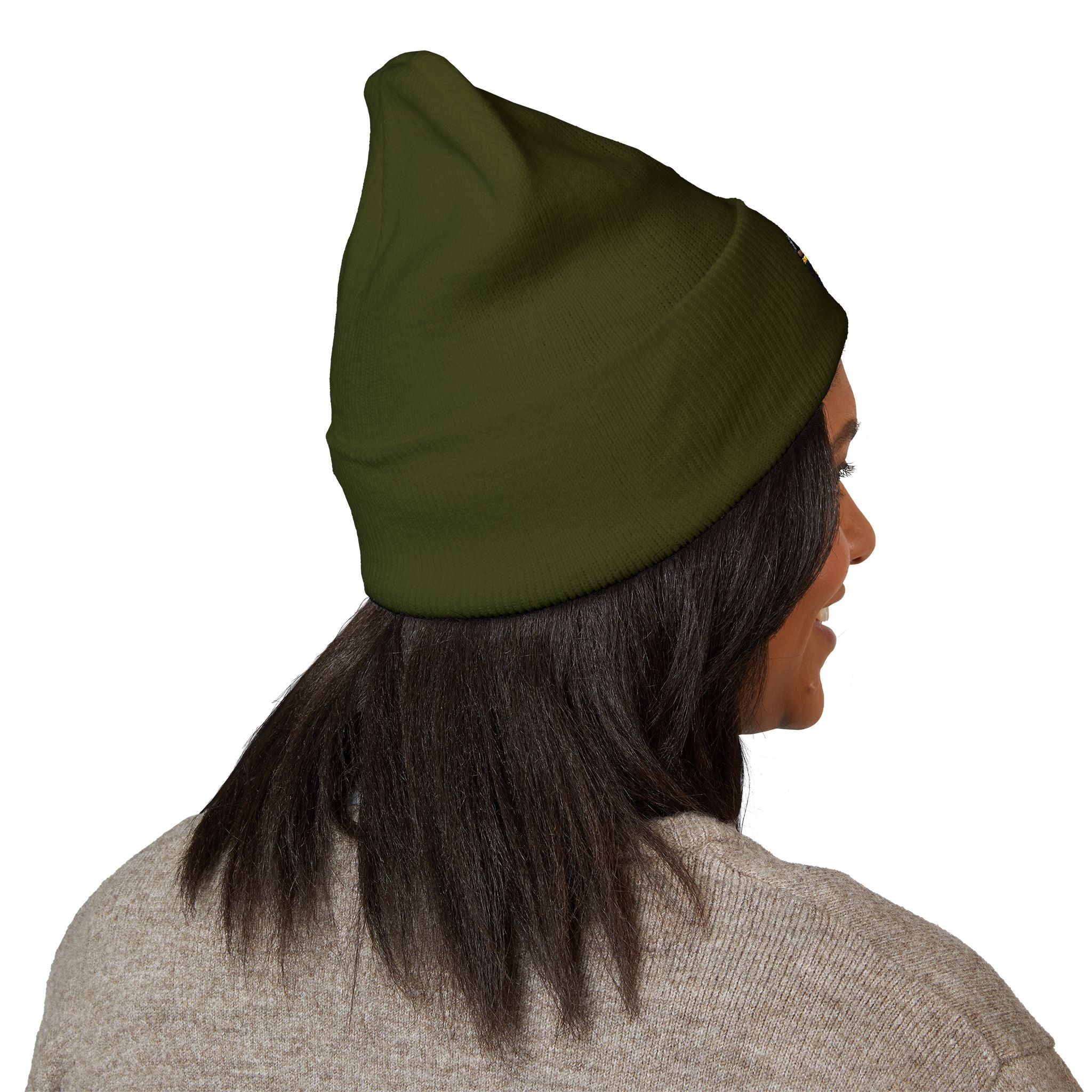 Person wearing a green beanie on a white background