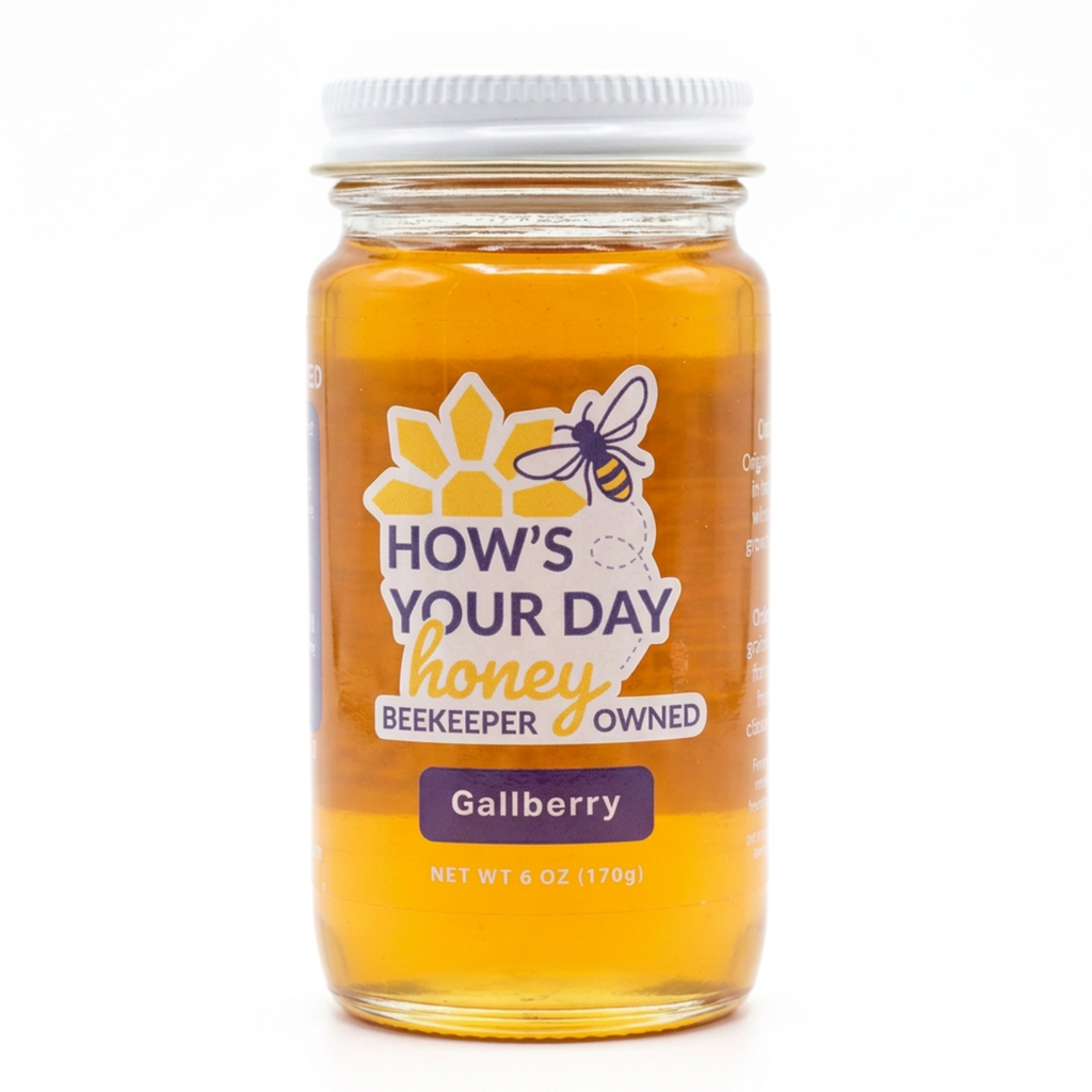 A glass jar of Gallberry honey with a white lid, featuring a label that reads 'HOW'S YOUR DAY honey BEEKEEPER OWNED' and 'Gallberry' on a white background.