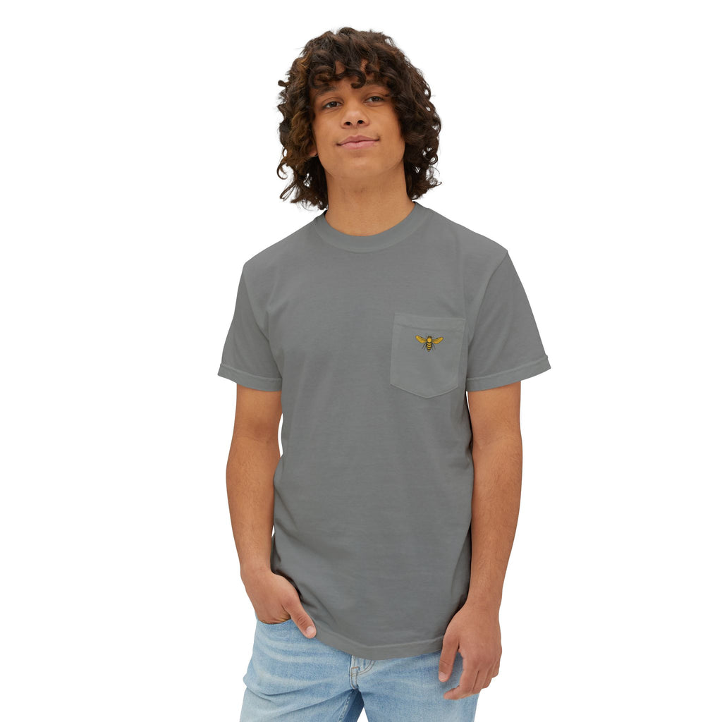 Person wearing a gray t-shirt with a pocket and logo on a white background