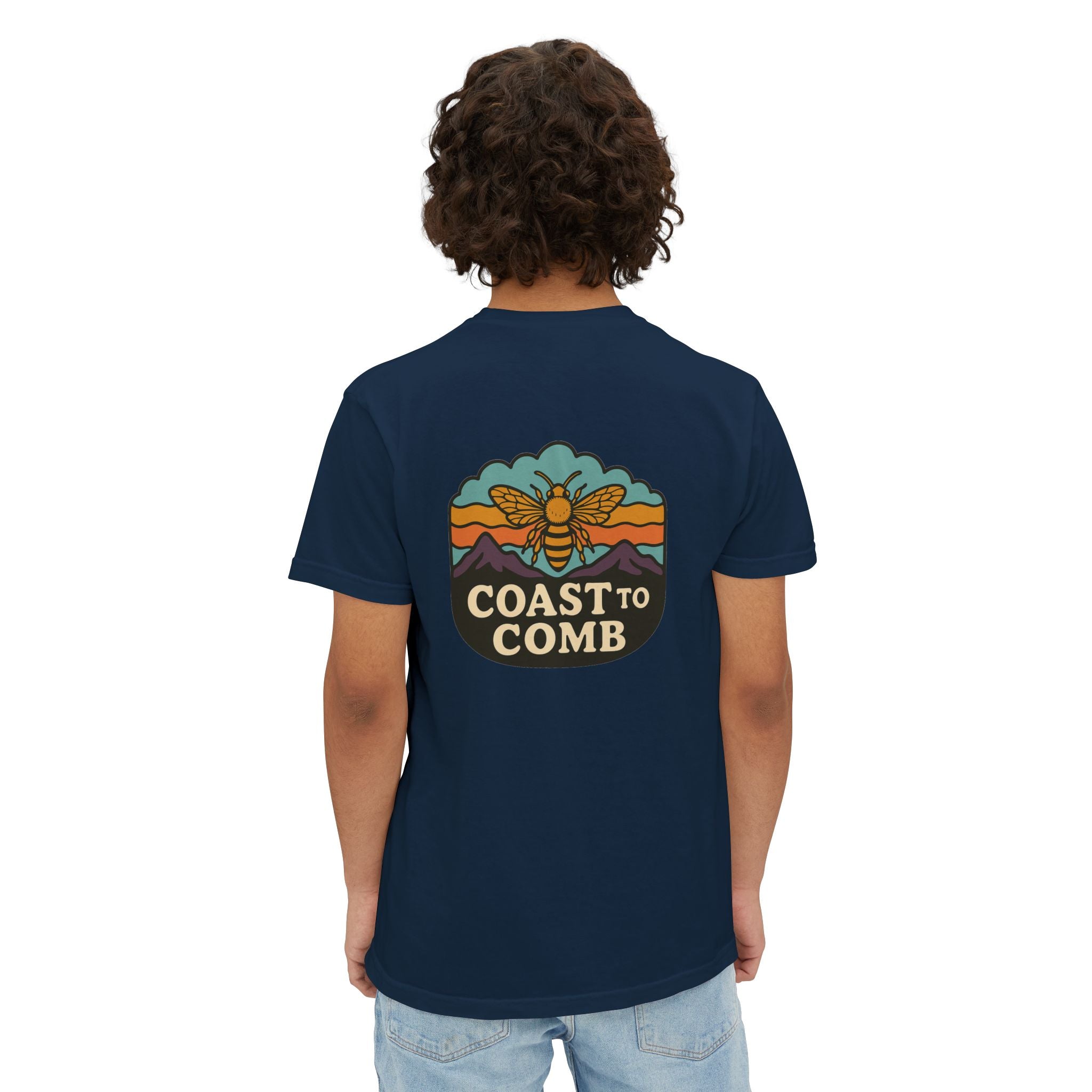 Person wearing a navy blue t-shirt with 'Coast to Comb' design on the back, standing against a white background.