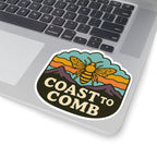 Sticker with a bee design and 'Coast to Comb' text on a laptop